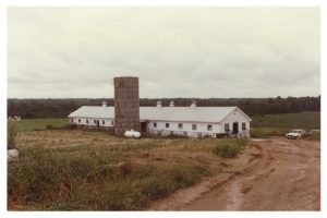 A long white building with a tall brick chimney in the middle. Pope Memorial Humane Society - Cocheco Valley's original building.